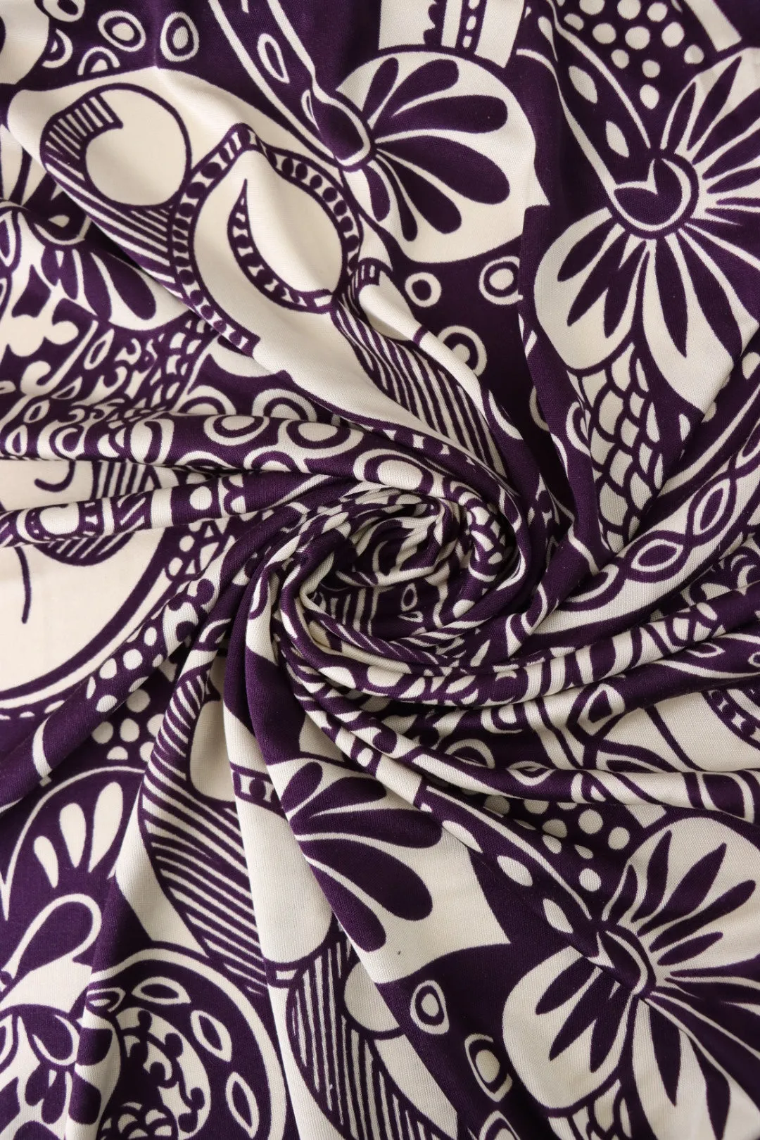 Whimsical Cream Art on Eggplant 100% Silk Jersey